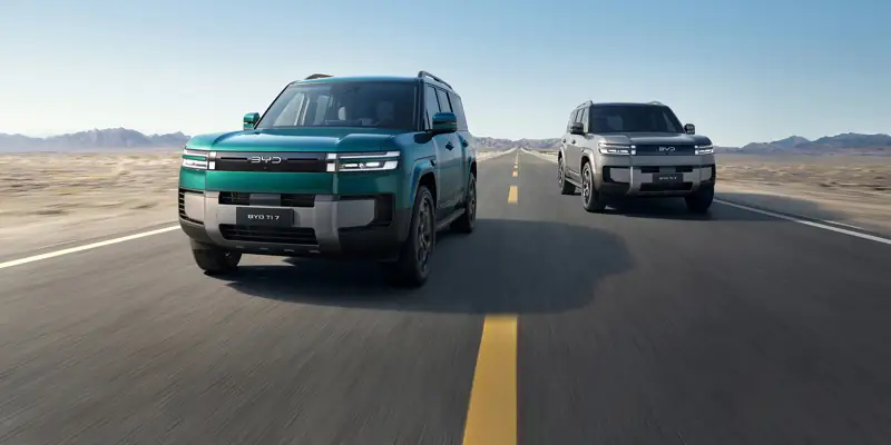 Two BYD Leopard 7 SUVs on a long open road